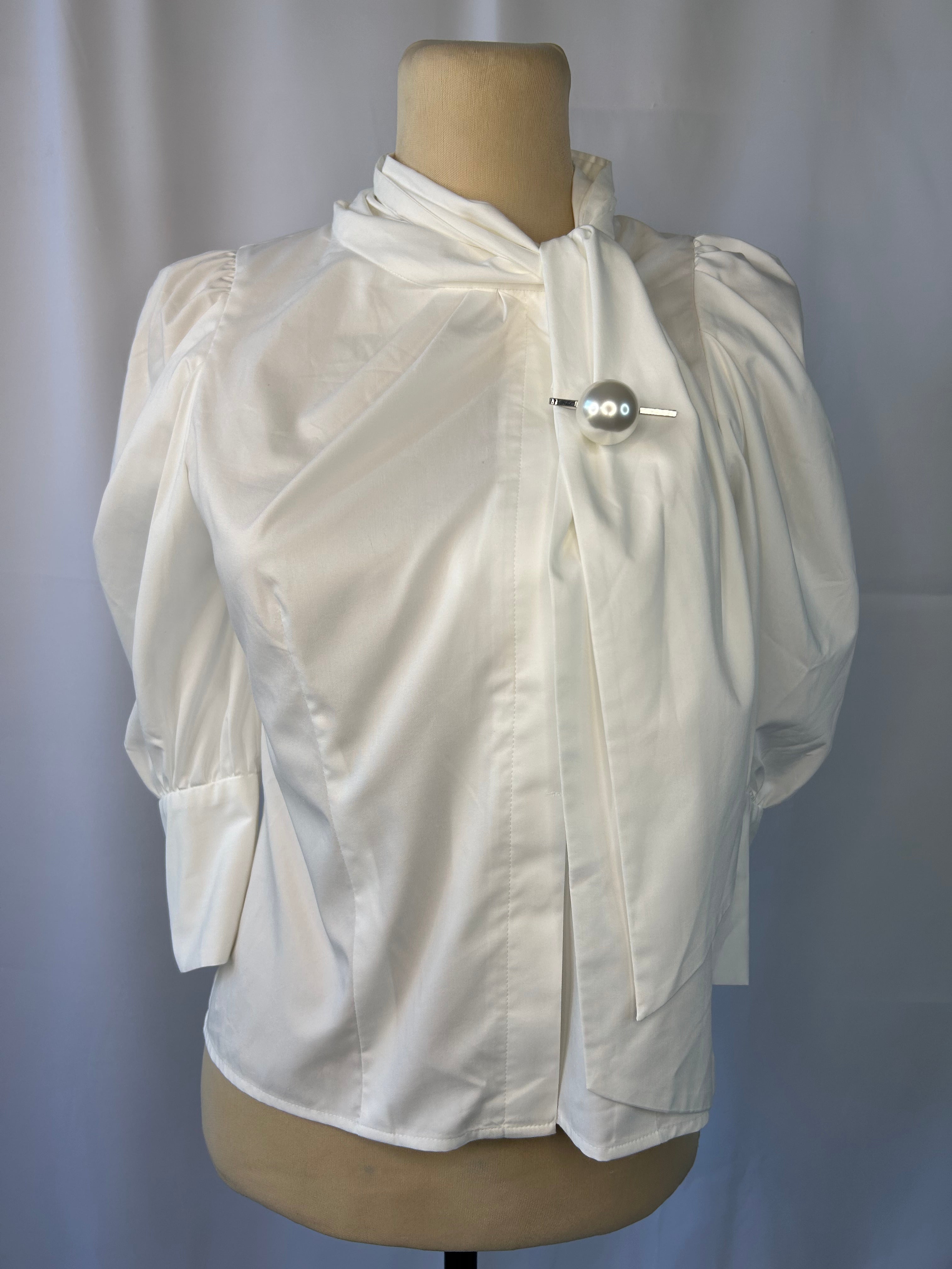 White Blouse With Pearl Brooch Pin